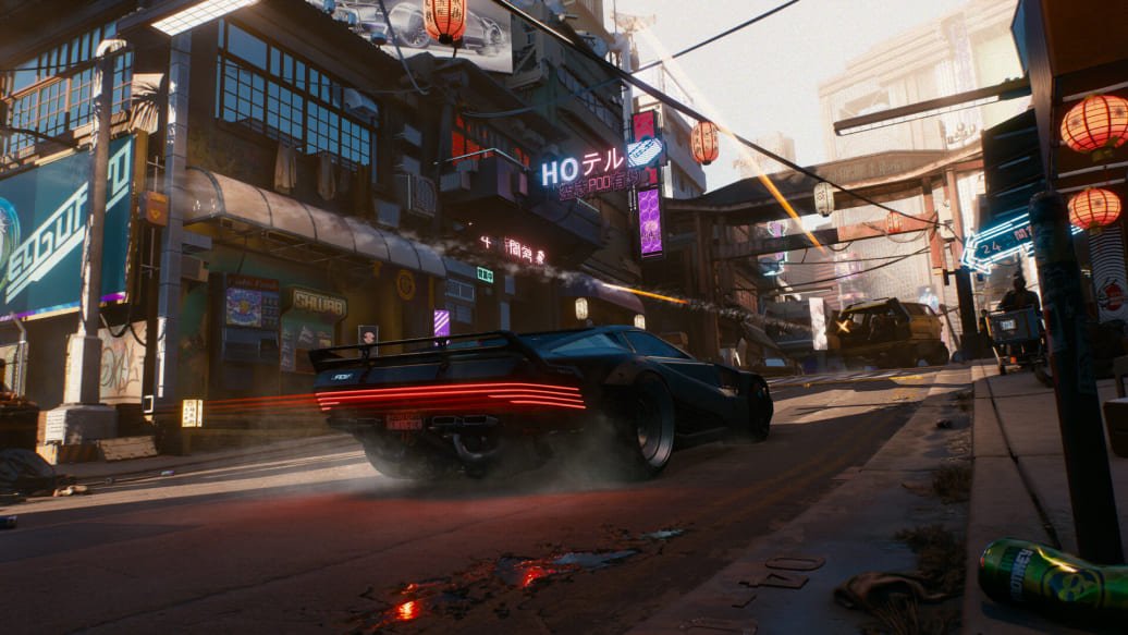 Cyberpunk 2077 gameplay showing a futuristic car driving through the neon-lit streets of Night City